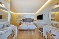 Łóżko lub łóżka w pokoju w obiekcie Boutiquehotel El Coto