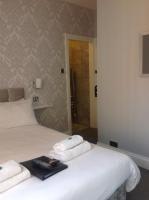 Postel nebo postele na pokoji v ubytování Grosvenor Hotel