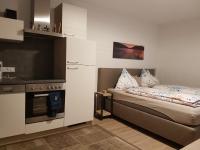 Łóżko lub łóżka w pokoju w obiekcie Appartement Daniel Kaprun