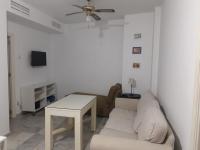 A television and/or entertainment centre at Two Bedrooms Leonor Davalos 2