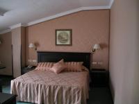 A bed or beds in a room at Santiago