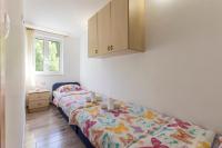 Postel nebo postele na pokoji v ubytování Apartmani Marinela