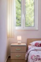 Postel nebo postele na pokoji v ubytování Apartmani Marinela