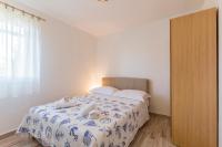 Postel nebo postele na pokoji v ubytování Apartmani Marinela