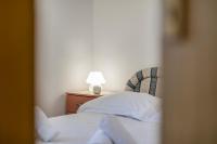Postel nebo postele na pokoji v ubytování Apartmani Marinela