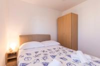Postel nebo postele na pokoji v ubytování Apartmani Marinela