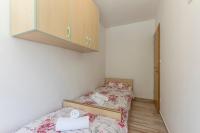 Postel nebo postele na pokoji v ubytování Apartmani Marinela