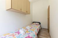 Postel nebo postele na pokoji v ubytování Apartmani Marinela