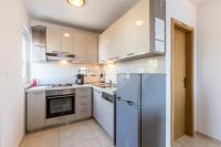 Kuchyň nebo kuchyňský kout v ubytování Apartmani Marinela