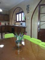 a kitchen with a table with a plant on it at Casa Rural La Verdura in Ubrique