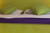 A bed or beds in a room at Balenax Pensión