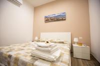 A bed or beds in a room at Marta House