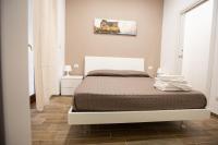 A bed or beds in a room at Marta House