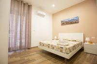 A bed or beds in a room at Marta House