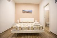 A bed or beds in a room at Marta House