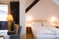 Łóżko lub łóżka w pokoju w obiekcie Alpine Spa Hotel Haus Hirt