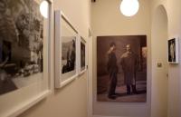 a group of pictures hanging on a wall at OFFICINA TESINI Guest Rooms Verona in Verona