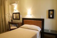 Postel nebo postele na pokoji v ubytování Hotel Karthea
