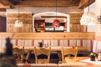 a dining room with a table and chairs at Living & Spa Vitalhotel Edelweiss in Neustift im Stubaital