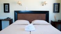 Postel nebo postele na pokoji v ubytování Hotel Karthea