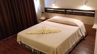 Postel nebo postele na pokoji v ubytování Nan Chao Hotel