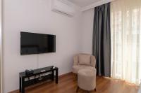 TV a/nebo společenská místnost v ubytování Joy Suites