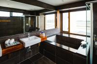 a bathroom with a sink and a shower at 輕塵別院Serenegray B&amp;B in Wujie