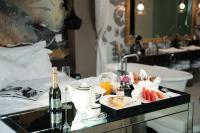 a tray of food and drinks on a table in a bathroom at Hotel de l'Opera Hanoi - MGallery in Hanoi