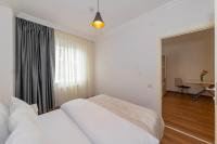 Postel nebo postele na pokoji v ubytování Joy Suites