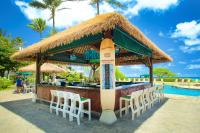 a bar with a surfboard on top of it at OUTRIGGER Kaua'i Beach Resort & Spa in Lihue