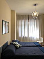 Posteľ alebo postele v izbe v ubytovaní Napoli City Inn