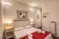 Posteľ alebo postele v izbe v ubytovaní GuestHouse o Affittacamere La civetta di Trastevere