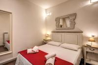 Posteľ alebo postele v izbe v ubytovaní GuestHouse o Affittacamere La civetta di Trastevere