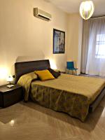 Posteľ alebo postele v izbe v ubytovaní Napoli City Inn