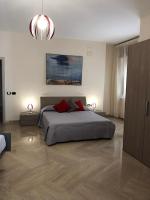 Posteľ alebo postele v izbe v ubytovaní Napoli City Inn