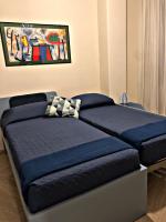 Posteľ alebo postele v izbe v ubytovaní Napoli City Inn