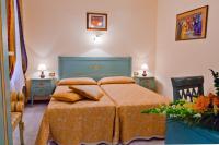 a bedroom with a bed with two pillows on it at Hotel Henry in Venice