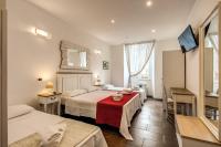 Posteľ alebo postele v izbe v ubytovaní GuestHouse o Affittacamere La civetta di Trastevere