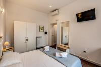 Posteľ alebo postele v izbe v ubytovaní GuestHouse o Affittacamere La civetta di Trastevere