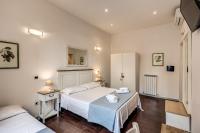 Posteľ alebo postele v izbe v ubytovaní GuestHouse o Affittacamere La civetta di Trastevere