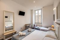 Posteľ alebo postele v izbe v ubytovaní GuestHouse o Affittacamere La civetta di Trastevere