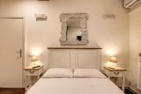 Posteľ alebo postele v izbe v ubytovaní GuestHouse o Affittacamere La civetta di Trastevere