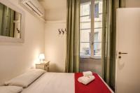 Posteľ alebo postele v izbe v ubytovaní GuestHouse o Affittacamere La civetta di Trastevere