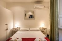 Posteľ alebo postele v izbe v ubytovaní GuestHouse o Affittacamere La civetta di Trastevere