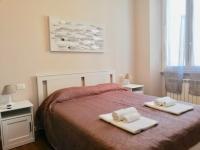 Posteľ alebo postele v izbe v ubytovaní Bixio Suites