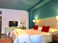 a hotel room with two beds and a television at Hotel Ritual Torremolinos- Adults Only in Torremolinos