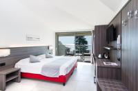 Łóżko lub łóżka w pokoju w obiekcie Hotel Domaso