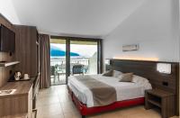 Łóżko lub łóżka w pokoju w obiekcie Hotel Domaso