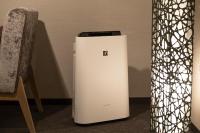 a small white refrigerator sitting next to a chair at Tokyu Stay Kyoto Sanjo-Karasuma in Kyoto