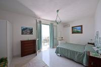 A bed or beds in a room at Villa Punta del Sole